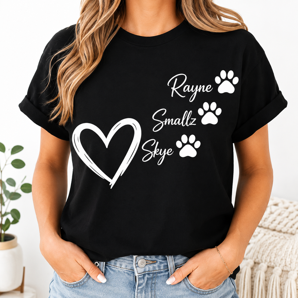 Woman wearing black personalized pet name shirt with white heart and three paw prints
