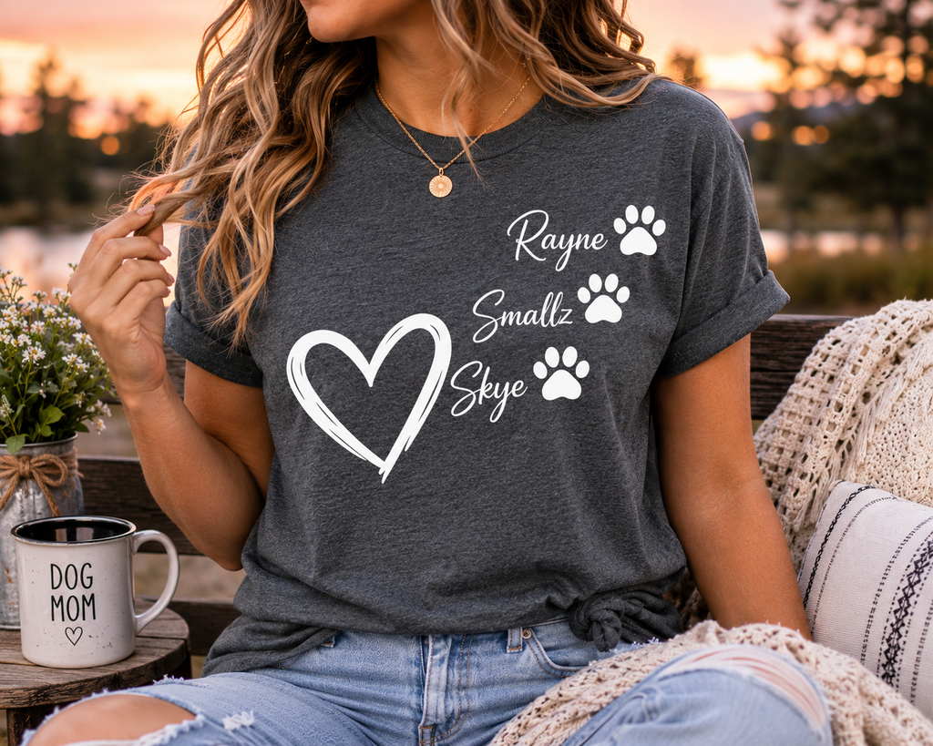 Woman wearing dark gray personalized dog mom shirt with three pet names