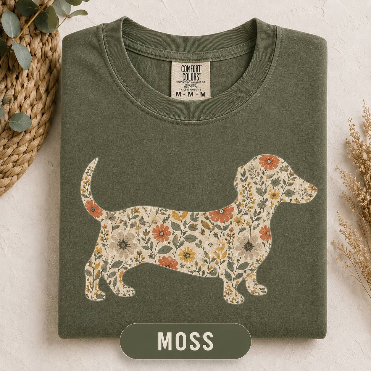 Close-up of the floral Dachshund graphic on a garment-dyed tee